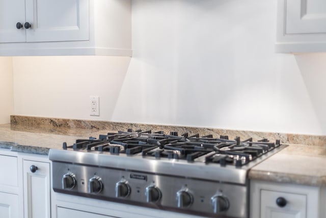 780 Craigville Beach Rd Unit B1, Centerville, MA 02632 - kitchen view of stainless steel gas stovetop and white cabinetry