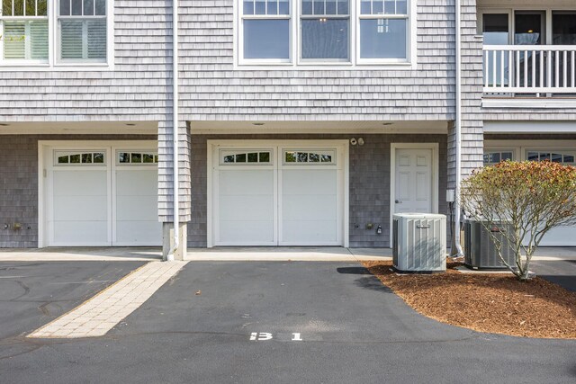 780 Craigville Beach Rd Unit B1, Centerville, MA 02632 - property entrance with central air condition unit and a garage