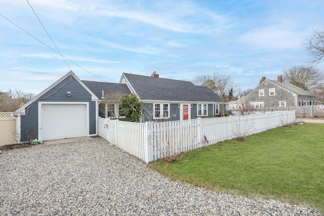 ranch-style home with a garage and a front lawn