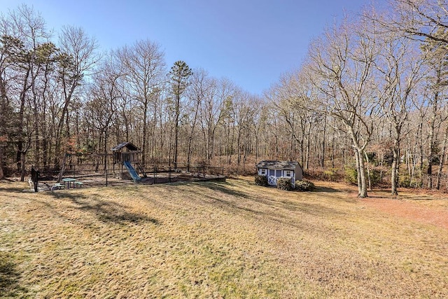 view of yard with a playground and an outdoor structure