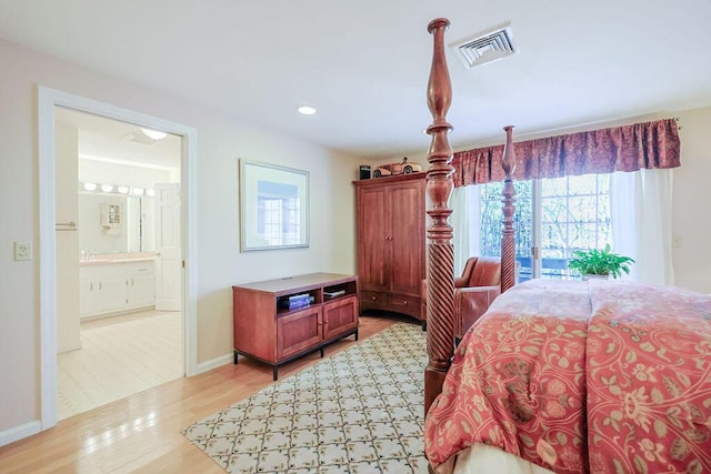 bedroom with visible vents, baseboards, ensuite bath, light wood-style flooring, and recessed lighting