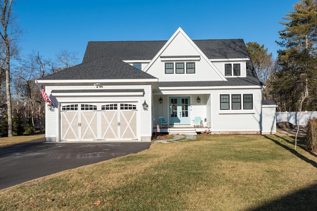 view of front facade featuring a garage and a front yard