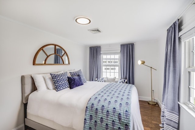 bedroom featuring dark wood-style flooring and baseboards