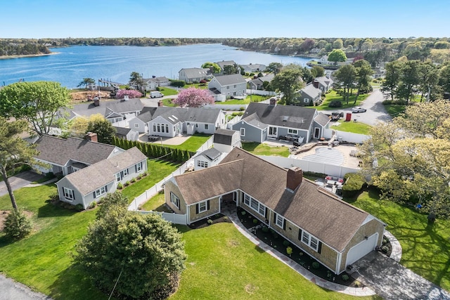 aerial perspective of suburban area featuring a nearby body of water
