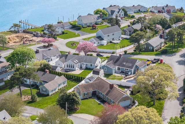 aerial view of residential area with a nearby body of water