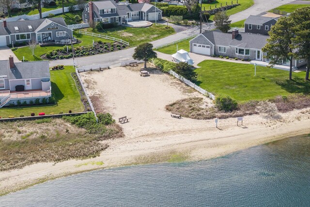 aerial view of residential area with a large body of water