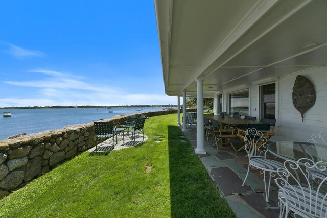 view of yard featuring a patio and a water view