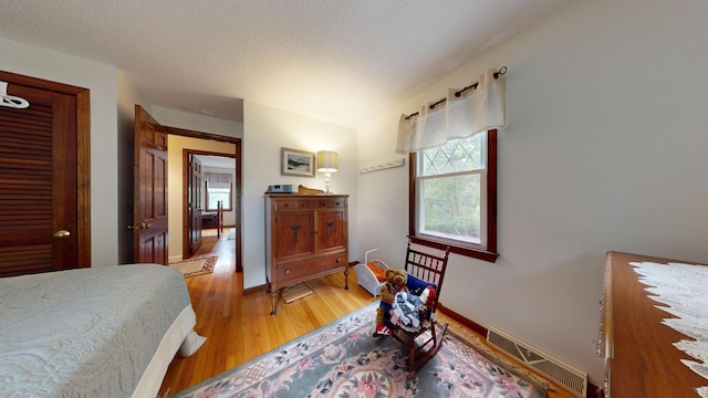 14 Daisy Ln, South Yarmouth, MA 02664 - bedroom with light wood-style flooring