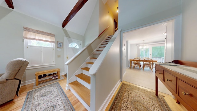 14 Daisy Ln, South Yarmouth, MA 02664 - stairway featuring plenty of natural light, wood finished floors, beam ceiling, baseboards, and high vaulted ceiling