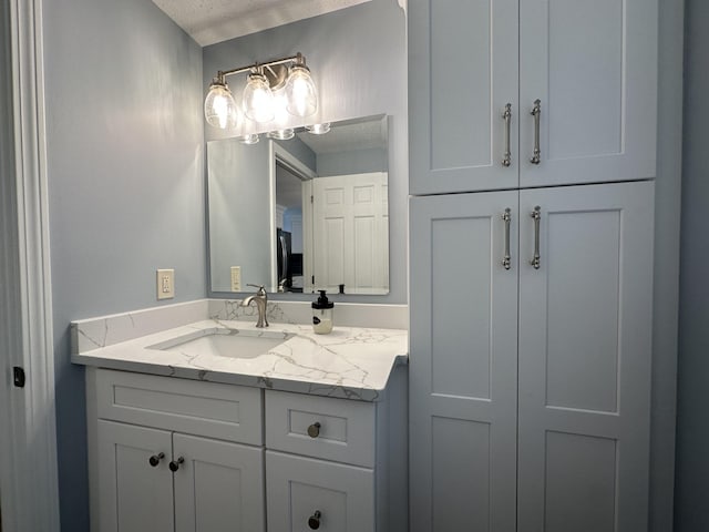 14 Daisy Ln, South Yarmouth, MA 02664 - bathroom with vanity and a textured ceiling