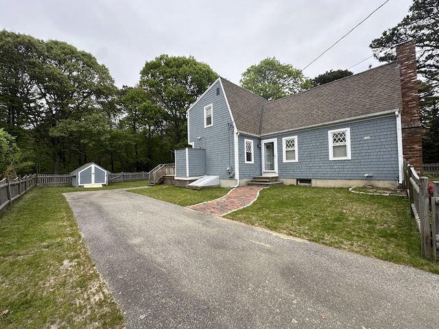 14 Daisy Ln, South Yarmouth, MA 02664 - view of front of house with a shingled roof and a chimney