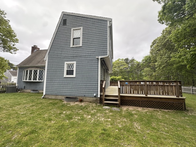 14 Daisy Ln, South Yarmouth, MA 02664 - back of property featuring a deck, central air condition unit, and a chimney