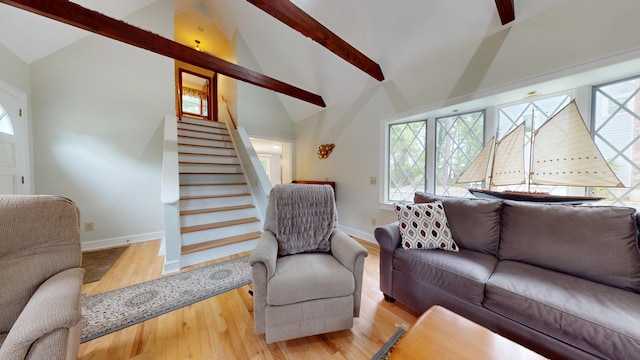 14 Daisy Ln, South Yarmouth, MA 02664 - living room featuring baseboards, beam ceiling, wood finished floors, healthy amount of natural light, and high vaulted ceiling