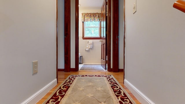 14 Daisy Ln, South Yarmouth, MA 02664 - hall featuring light wood finished floors, baseboards, and radiator