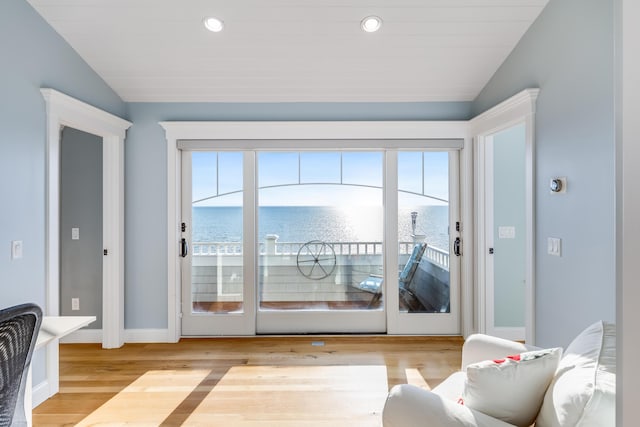 15 W Rd, Eastham, MA 02642 - doorway to outside with vaulted ceiling, light wood finished floors, a water view, and recessed lighting