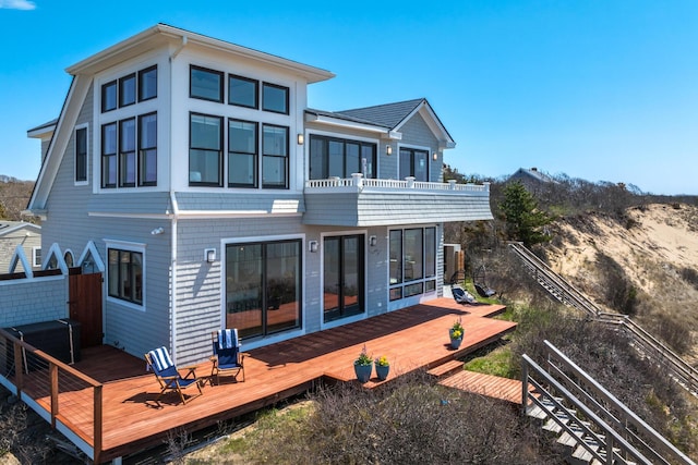 15 W Rd, Eastham, MA 02642 - back of property with a wooden deck and a balcony