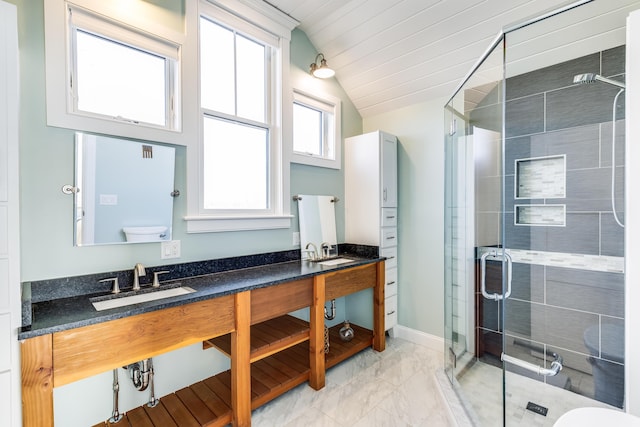 15 W Rd, Eastham, MA 02642 - bathroom with double vanity, a shower stall, lofted ceiling, and marble finish flooring