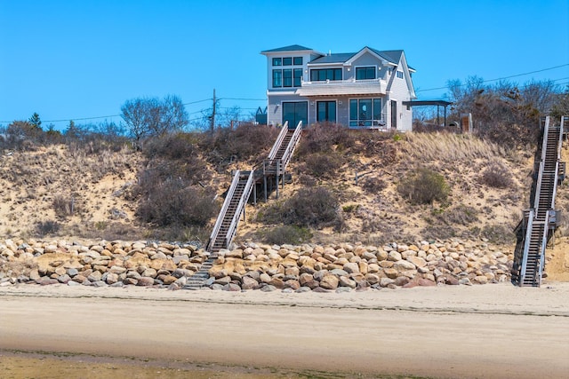 15 W Rd, Eastham, MA 02642 - view of front of property featuring stairway and a balcony