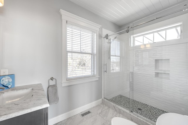 15 W Rd, Eastham, MA 02642 - full bath featuring a stall shower, vanity, and marble finish flooring