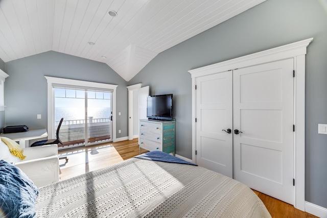 15 W Rd, Eastham, MA 02642 - bedroom featuring lofted ceiling, light wood-style flooring, and access to outside