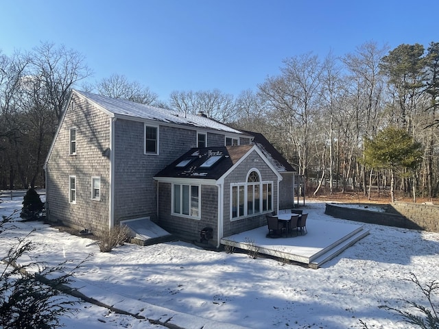 view of snow covered house