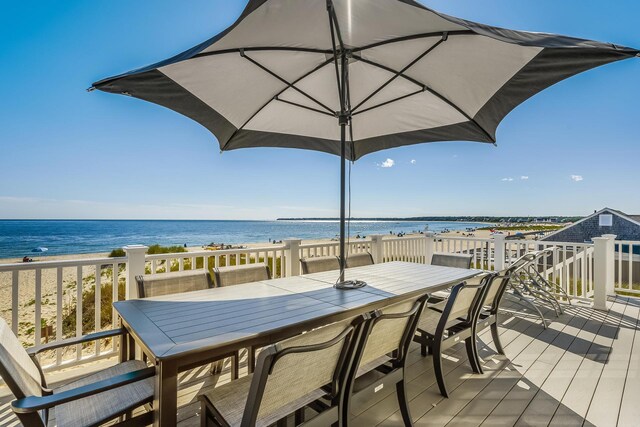 deck featuring a water view and a view of the beach