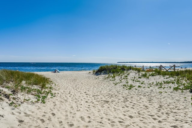 property view of water featuring a beach view