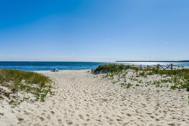 property view of water featuring a beach view