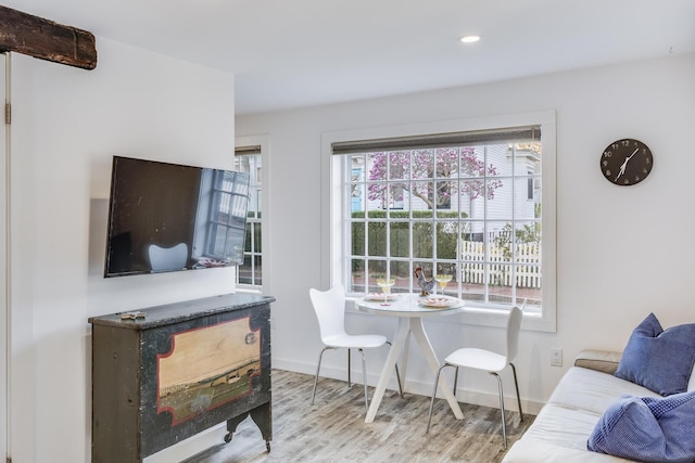 living area featuring wood finished floors, baseboards, and recessed lighting