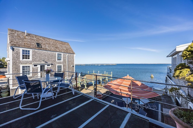 view of patio / terrace featuring a water view and outdoor dining space