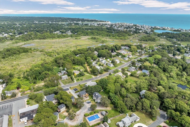 111 School St Unit 6, West Dennis, MA 02670 - aerial view of property and surrounding area featuring a large body of water and a tree filled landscape