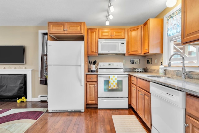 111 School St Unit 6, West Dennis, MA 02670 - kitchen featuring white appliances, dark wood-type flooring, light stone countertops, baseboard heating, and track lighting
