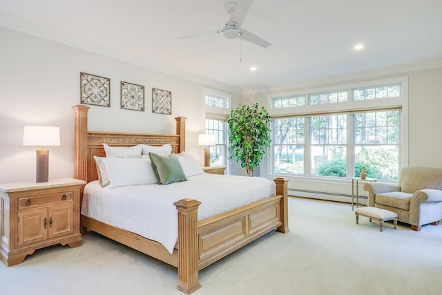 carpeted bedroom featuring a baseboard radiator, ceiling fan, and crown molding