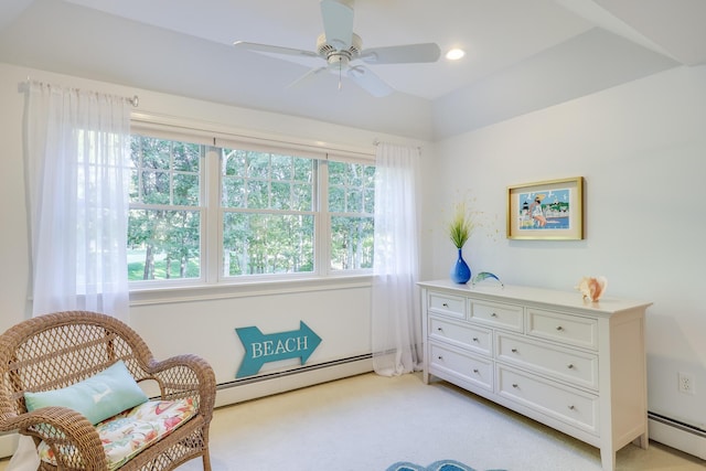 living area featuring light carpet, ceiling fan, and baseboard heating