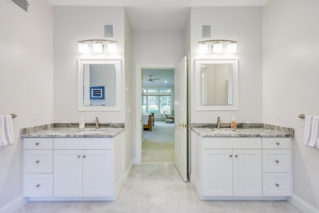 bathroom featuring vanity and ceiling fan