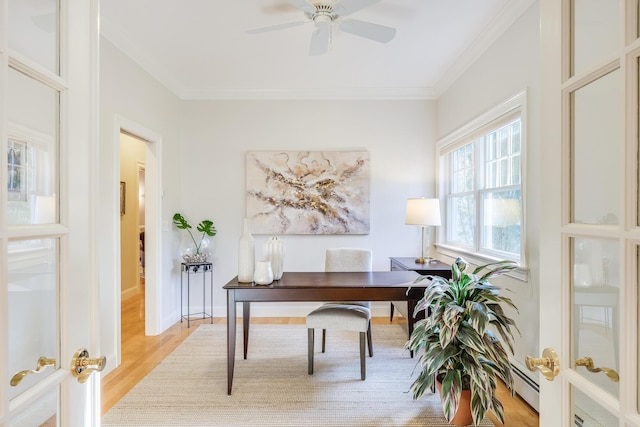 office area featuring light hardwood / wood-style floors, ornamental molding, and french doors