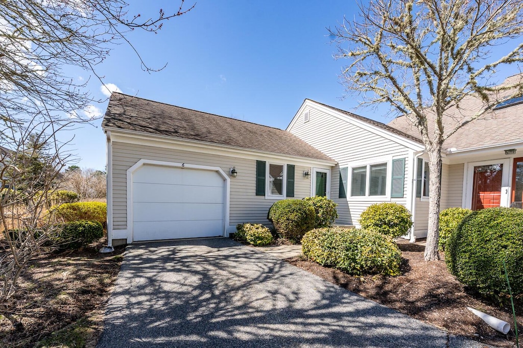 6 Masters Ct, Mashpee, MA 02649 - view of front facade with aphalt driveway, roof with shingles, and an attached garage