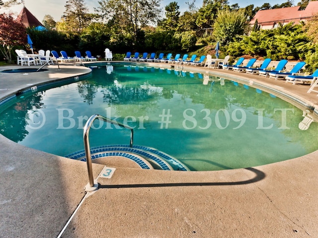 community pool with a patio