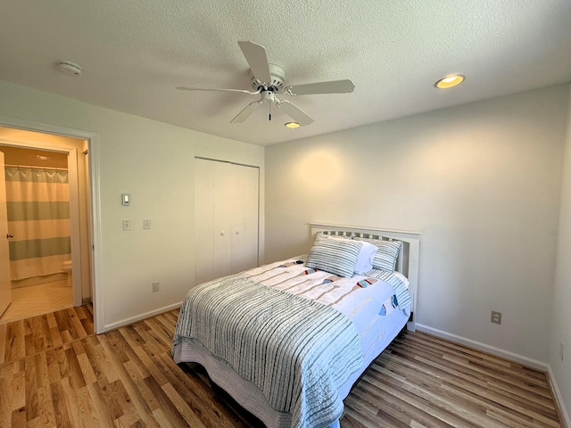 40 Eaton Ln, Brewster, MA 02631 - bedroom featuring light wood-style floors, baseboards, a textured ceiling, ceiling fan, and a closet