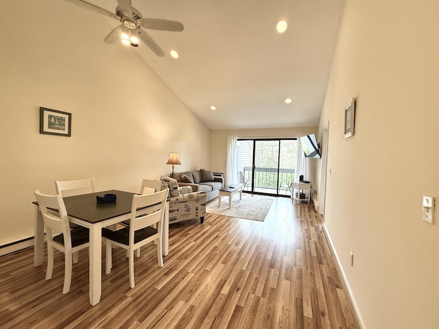 40 Eaton Ln, Brewster, MA 02631 - dining area featuring wood finished floors, ceiling fan, baseboards, recessed lighting, and high vaulted ceiling