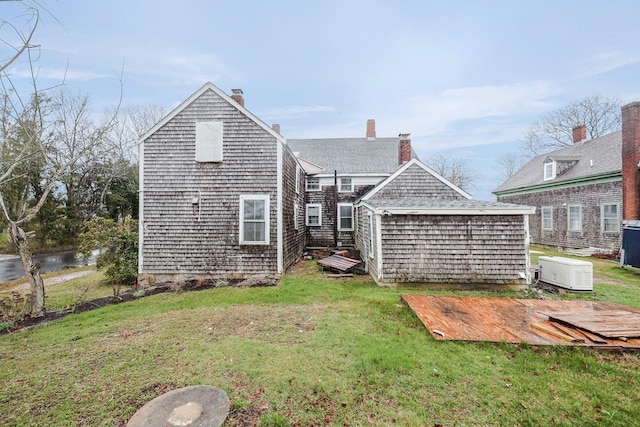 32 Church St, Sandwich, MA 02563 - rear view of property with a lawn, a storage unit, and a deck
