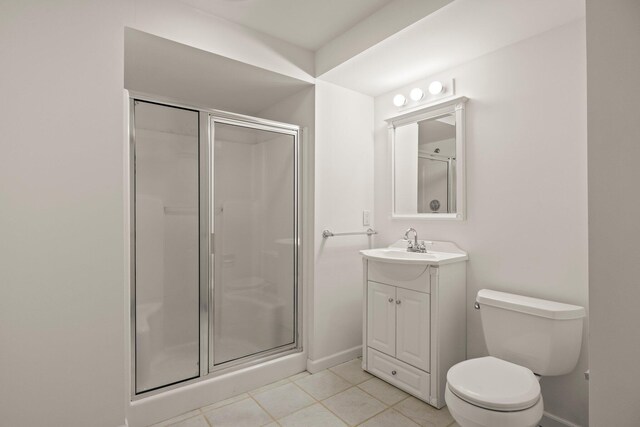 47 Cove View Dr, South Yarmouth, MA 02664 - bathroom featuring a shower stall, toilet, tile patterned flooring, vanity, and baseboards