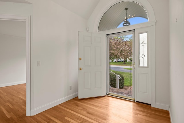 47 Cove View Dr, South Yarmouth, MA 02664 - entrance foyer featuring vaulted ceiling, light wood-style floors, and baseboards
