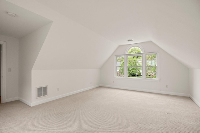 47 Cove View Dr, South Yarmouth, MA 02664 - additional living space featuring light colored carpet, vaulted ceiling, and baseboards