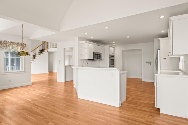 47 Cove View Dr, South Yarmouth, MA 02664 - kitchen with appliances with stainless steel finishes, baseboards, open shelves, light wood-style floors, and recessed lighting