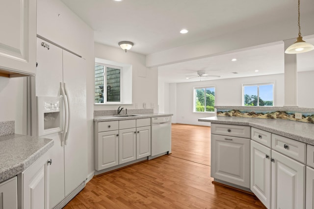 47 Cove View Dr, South Yarmouth, MA 02664 - kitchen featuring white appliances, a sink, light wood finished floors, and recessed lighting