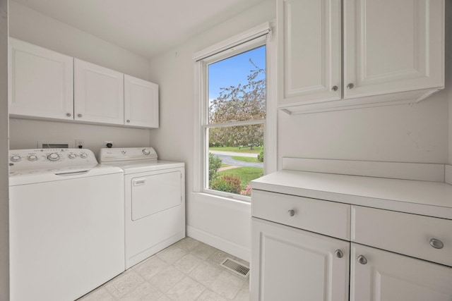 47 Cove View Dr, South Yarmouth, MA 02664 - washroom featuring cabinet space, independent washer and dryer, plenty of natural light, and baseboards