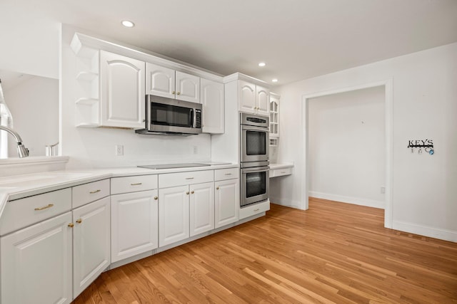 47 Cove View Dr, South Yarmouth, MA 02664 - kitchen featuring stainless steel appliances, open shelves, light wood-type flooring, a sink, and recessed lighting
