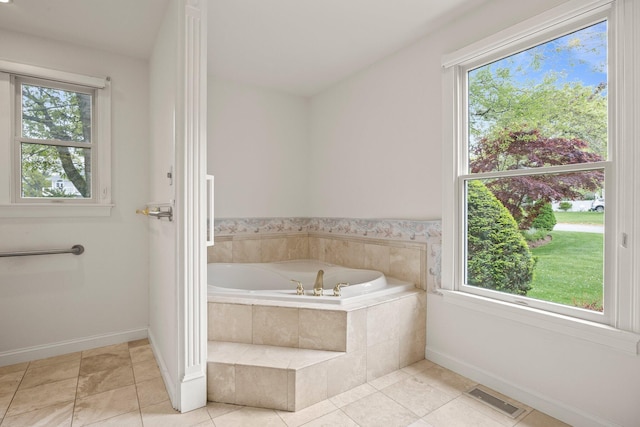 47 Cove View Dr, South Yarmouth, MA 02664 - bathroom with a bath, baseboards, and healthy amount of natural light