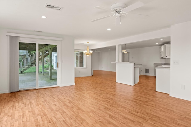 47 Cove View Dr, South Yarmouth, MA 02664 - unfurnished living room with light wood-style floors, a chandelier, recessed lighting, baseboards, and a ceiling fan